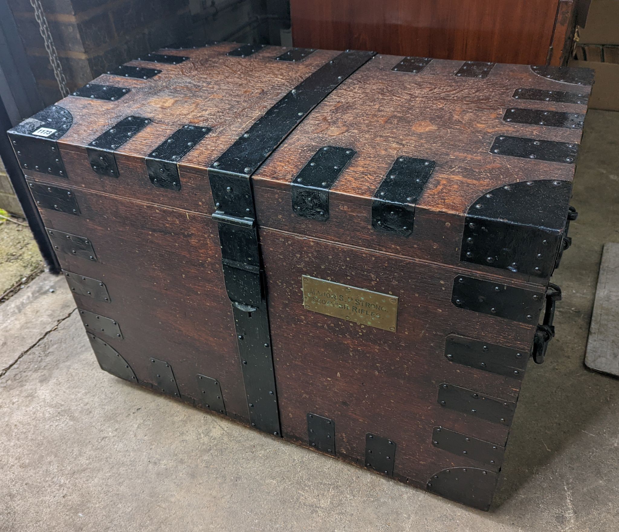 A Victorian iron bound oak silver chest, bears engraved brass plaque Major S. P. Strong, Scottish Rifles, length 82cm, depth 61cm, height 57cm